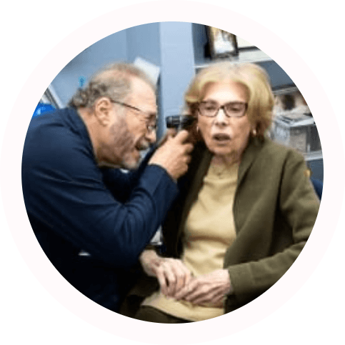 Valley Hearing Center audiologist looking into a patients ears
